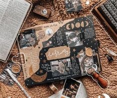 an open book on top of a brown blanket next to other items and bookshelves