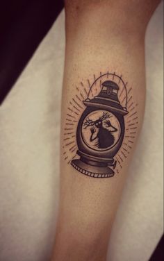 a person with a clock tattoo on their leg