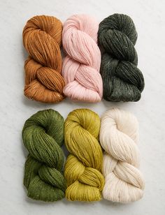 four skeins of yarn in different colors