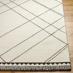 a white rug with black lines on it