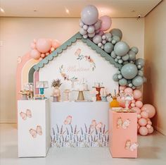 a baby's first birthday party with balloons and decorations