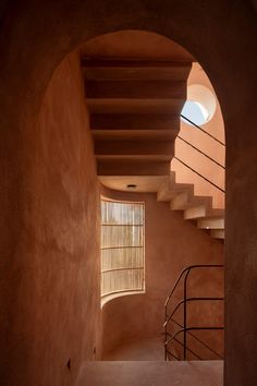 an arched doorway leading up to a stairwell