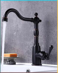 a black faucet with water running from it