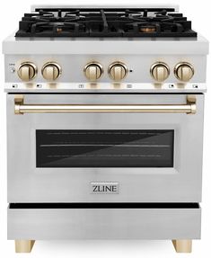 a white and gold stove with four burners