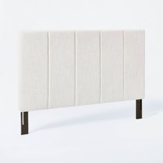 an upholstered headboard is shown against a white background