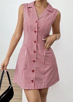 a woman in a red and white checkered dress is holding a black handbag