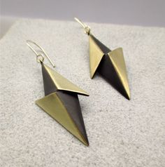 "Lightning earrings, 3D jewelry, Minimalist Abstract jewellery, Geometric earrings, Dangle long earrings, Contemporary jewelry, Black and gold earrings, Thunder jewelry, Architecture jewelry, Bauhaus earrings Two 3d triangles soldered together to create a 3d lightning bolt.  The motifs are made of brass, they are oxidized with black patina to make a nice contrast between the two angles and they have a matte finish. They are hanging from sterling silver hooks. Dimensions Length of the earring: ap Modernist Black Earrings For Gift, Modernist Black Earrings As Gift, Bauhaus Earrings, Jewelry Architecture, Architecture Jewelry, Modern Geometric Jewelry, Lightning Earrings, Black And Gold Earrings, Lotus Temple