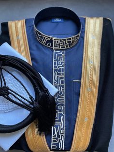 "This full set includes not just the thobe (An exquisite Saudi jubba) but also a pure wool bisht, kufi cap, 100% cotton scarf, and wool agal (igal). Each piece complements the other, creating a harmonious and sophisticated ensemble. This thobe set is perfect for special occasions like a nikah, weddings, Ramadan, Eid, or any moment where making a sophisticated statement is key. Luxurious Fabric: The thobe is expertly crafted using high-quality Japanese anti-static material Intricate Gold Embroidery: Each stitch reflects a commitment to impeccable attention to detail Handcrafted: Every element of the Light Grey Thobe Set is handmade with precision. What's Included: 1. Thobe x 1 2. Bisht x 1 3. 100% Cotton White Scarf (55\") x 1 4. Agal Of Your Choice x 1 5. Skull Cap x 1   Thobe Style: Saudi Arab Hat, Kufi Cap, Mens Fur Coat, Mens Fur, White Scarves, Wool Thread, Hand Stitch, Muslim Wedding, Gold Embroidery