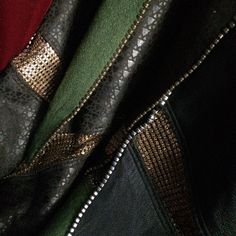 the zippers on this jacket are black and gold