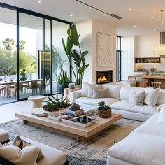 a living room filled with furniture and a fire place