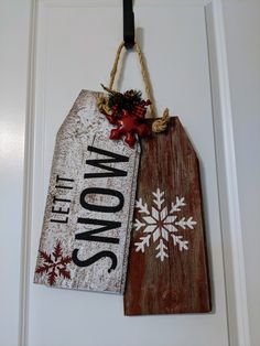 two wooden signs hanging on a door hanger