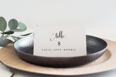 a place card sitting on top of a plate