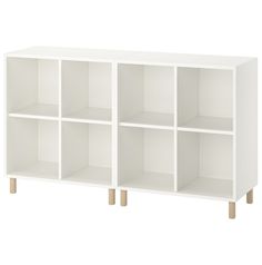 a white bookcase with wooden legs and four sections on each side, in front of a white background