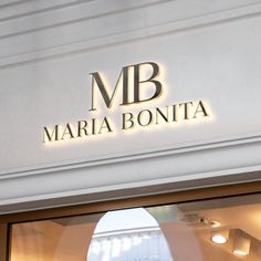 there is a sign that says marina bonita on the side of a building in front of a window