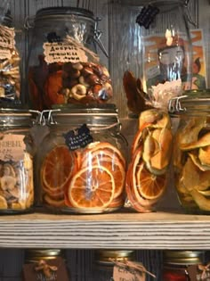 several jars filled with different types of fruit