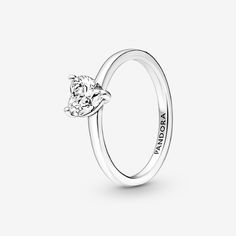 The latest addition to our solitaire collection, the Sparkling Heart Solitaire Ring features a heart-shaped clear cubic zirconia as the centerpiece. The Pandora logo is engraved on the inside of the polished shank. Stack this ring with other sterling silver pieces for a monochromatic look or mix metal finishes to make a unique statement. - Pandora Sparkling Heart Solitaire Ring - Sterling silver / Cubic Zirconia / Clear - Sz. 9