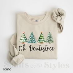 a shirt that says, oh dentistee and three trees with bows on it