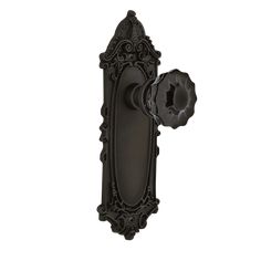 an ornate door handle with a keyhole