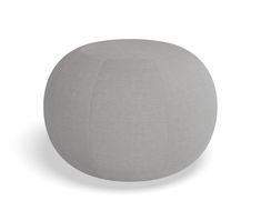 a large gray ball sitting on top of a white floor