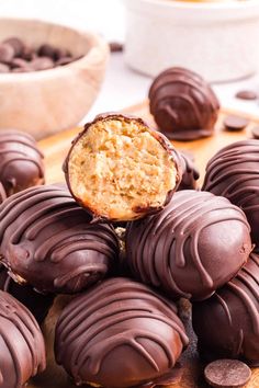 chocolate covered peanut butter balls on a cutting board