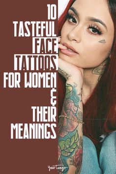 a woman with red hair and tattoos on her arm is looking at the camera while she's holding her hand near her face