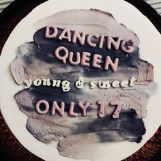 a cake with the words dancing queen and young & sweet only 17 on it's side