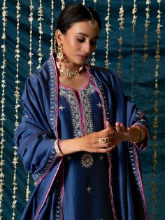 "Jashn-E-Ulfat" - a collection of ensembles that evoke a sense of majestic opulence and modern royalty. Suffused with deep rich hues set on plush cotton silk enhanced with remarkable craftsmanship like Marodi, Mirror and Zardozi embroidery, each ensemble has a romantic and feminine charm of its own collection. This set of 3 consists of a Kurta, Salwar and Dupatta. Kurta: This elegant blue chanderi silk kurta is enhaced with silver marodi work on the neck and sleeves and beautifully detailed with Marodi Work, Kurta And Dupatta, Silk Kurta Set, Modern Royalty, Blue Kurta, Zardozi Embroidery, Latest Dress Design, Silk Kurta, Dress Images