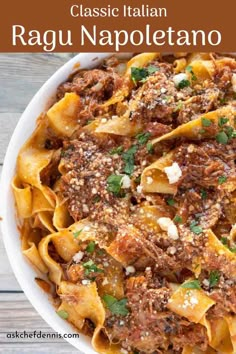 a white bowl filled with pasta and meat