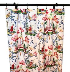 the curtain is decorated with flowers and birds