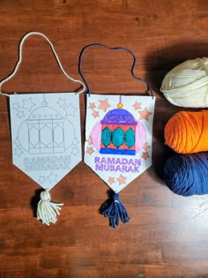 three crocheted items are displayed on a wooden surface, including yarn and an ornament