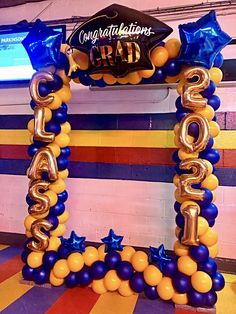 balloons are arranged in the shape of letters and stars