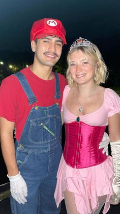 a man and woman dressed up as mario and princess peach are posing for the camera