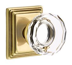 a glass door knob with a gold finish