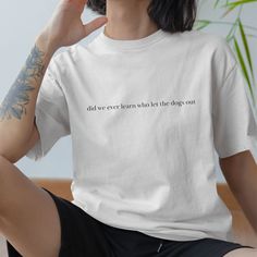 For when you find yourself wondering what happened to the Baha Men -- embrace it with our "did we ever learn who let the dogs out" Minimalist Tee! 💫 Simplicity meets style in this essential wardrobe staple. Our tee features a sleek design, a timeless silhouette, and a touch of modern minimalism that effortlessly elevates any outfit. Crafted from premium cotton. Key Features: ✨ Streamlined and chic design for the clean girl aesthetic. ✨ Soft and sustainable fabric for comfort and peace of mind. ✨ Versatile and effortless, perfect for dressing up or down. ✨ Available in neutral hues to complement any minimalist wardrobe. Experience the beauty of simplicity and let your inner cool girl shine with our Minimalist Tee. Whether you're strolling through the city or enjoying a relaxing day at home Minimalist Tshirt, Minimal Shirt Design, Minimalist Wardrobe, Sustainable Fabrics, Chic Design, Funny Shirts, Wardrobe Essentials, Cool Girl, Trendy Outfits