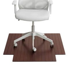 a white office chair sitting on top of a wooden floor next to a brown mat