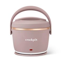 the crockpot electric cooker is pink and gold