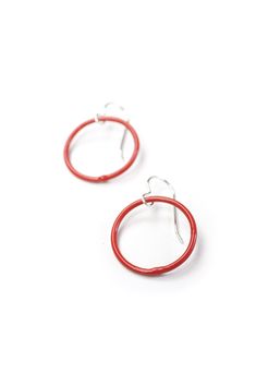 These lightweight circle earrings are sure to become your new favorite pair. An update on classic hoops, each circle retains evidence of their making - a small dot marks the spot where I hand-weld each earring. Approximately 1 1/4" tall (including ear wires) and 7/8" wide. Powder coated in a bright red color. Sterling silver ear wires. Handcrafted in my Pennsylvania studio. Ships in 1-2 business days. Comes in a gift box. Treat yourself or a loved one! Minimalist Red Round Earrings, Red Sterling Silver Earrings For Everyday, Adjustable Red Hoop Earrings, Small Red Hoop Earrings Nickel Free, Red Jewelry With Matching Earrings For Everyday, Red Small Hoop Nickel-free Earrings, Small Red Hypoallergenic Hoop Earrings, Small Red Nickel-free Hoop Earrings, Nickel-free Red Hoop Earrings