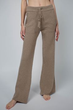 With its flair leg, seam free sides and flat waistband, the Alex pant is the chicest and most flattering lounge pant. Made from Italian eco cashmere, the pockets are lined in micro-jersey for a bulk-free appearance. Ultra soft and luxurious, you can pair the Alex with one of our matching sweaters, or simply with a t-shirt. This item is final sale! Fit: Ioni, our model is 5.8" or 1.77 m tall and wears size 0. Made from a medium-weight knit, the pant inseam measures 29 1/2" (75 cm). Content: 100% Sustainable Wardrobe, Cashmere Pants, Matching Sweaters, Finger Food, Lounge Pants, Medium Weight, Trousers Women, Romania, Leg Pants