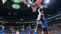 a basketball player dunking the ball into the hoop