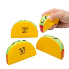 three pieces of yellow and green plastic with a person's hand holding the top