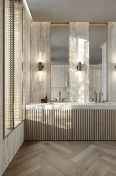 a large bathroom with two sinks and mirrors