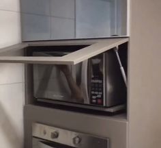 the microwave is built into the wall in the kitchen