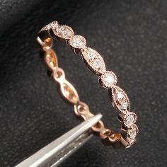 an image of a ring with diamonds on it