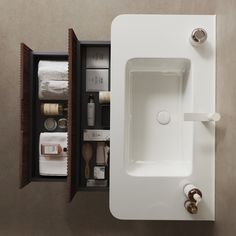 an open medicine cabinet in a bathroom