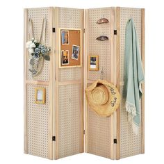 a room divider with pictures and hats on it