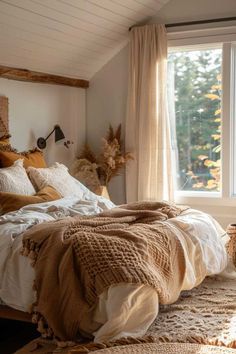 a large bed sitting under a window next to a wooden headboard and foot board