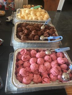 three trays filled with different types of ice cream and cookies on top of a table