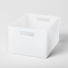 a white storage box with handles on the top and bottom, sitting against a white background