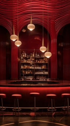 a bar with stools and lights hanging from it's red walls, along with several bottles on the shelves