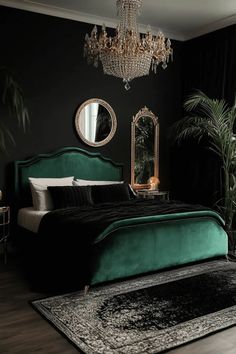 a bedroom with black walls and green velvet bedding, chandelier, rugs and mirror